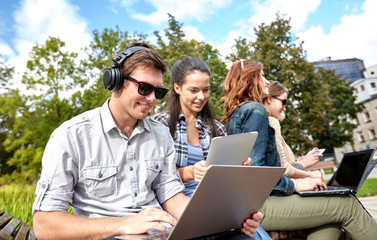 students or teenagers with laptop computers