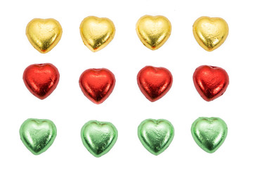 Fototapeta premium chocolate hearts candies on white