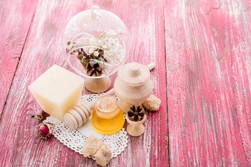 Obraz na płótnie Canvas spa treatment - star anise, honey, salt, arranged with soap bar