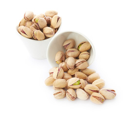 Heap of pistachios nuts isolated on the white