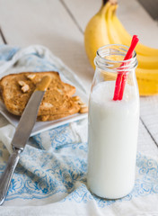 banana smoothie, toast with peanut butter, roasted peanuts, brea