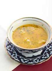 Bowl of chicken soup with vegetables and noodles