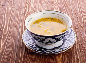 Bowl of chicken soup with vegetables and noodles