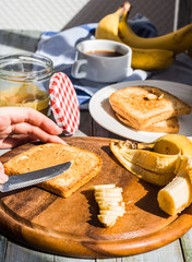 ruddy toast with peanut butter, sliced ​​bananas, coffee, br