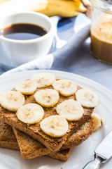 ruddy toast with peanut butter, sliced ​​bananas, coffee, br