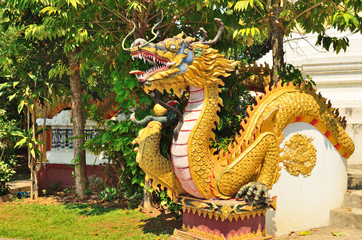 Dragon statue at temple wall