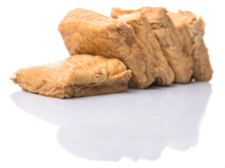 Homemade fried tofu over white background