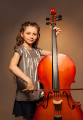 Classy girl with long hair holding cello to play © Sergey Novikov