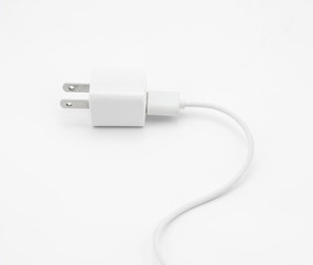 Plug with two flat pins on white background.
