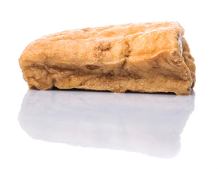 Homemade fried tofu over white background