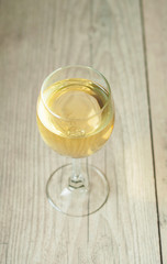 white wine in glass on vintage background