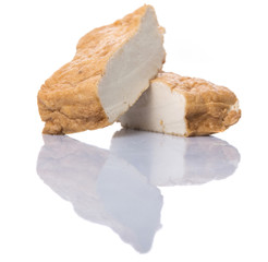 Homemade fried tofu over white background