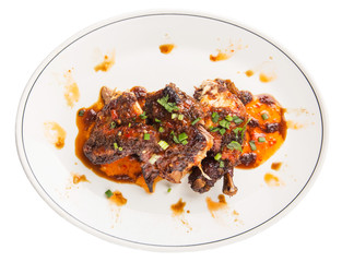 Roasted chicken piece coated with soy sauce