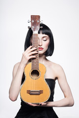 beautiful woman with bob haircut.guitar