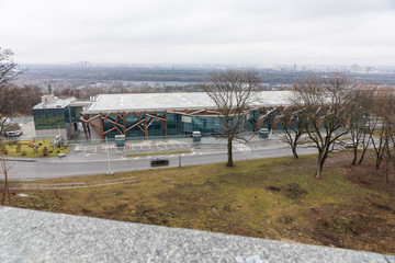 Street crossing between a field and a building