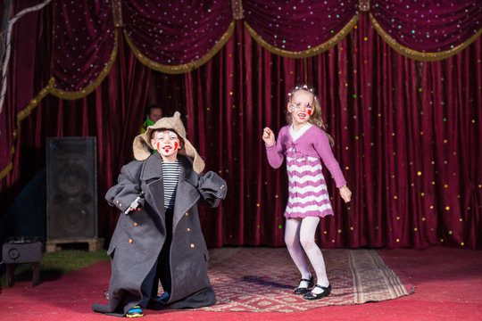 Children Dressed as Clowns Performing on Stage