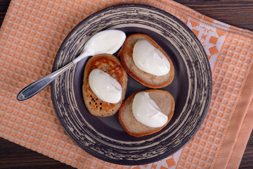 Fritters with sour cream