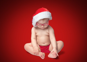 little baby with Santa hat and glasses