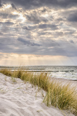 Coast of Baltic Sea with dark clouds