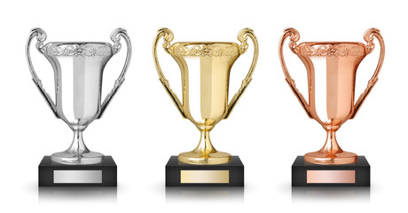 Golden, silver and bronze trophies isolated on white