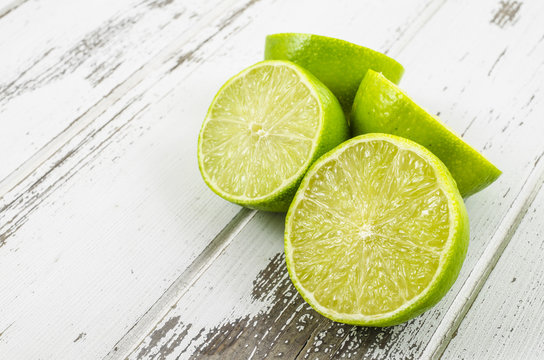 Fresh Limes On Wooden Table