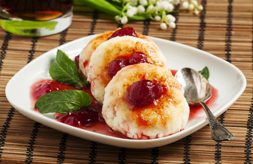 Homemade cottage cheese pancakes with strawberry jam, selective