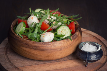 fresh vegetable salad with mozzarella and arugula