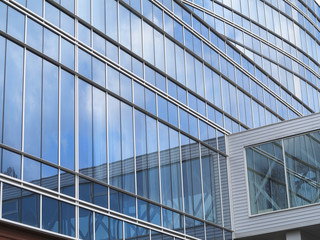 Abstract blue glass facade modern business center building
