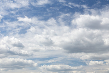 Fototapeta na wymiar Blue sky is full of huge white clouds
