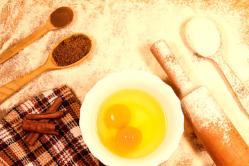 homemade baking. Kitchen rolling pin, spoon flour, broken eggs, sunflower oil, towel on a chopping Board