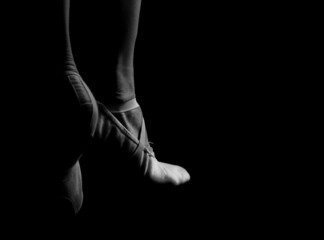 Women's legs in ballet shoes 