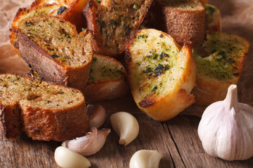 Slices toasted bread with herbs and garlic. horizontal
