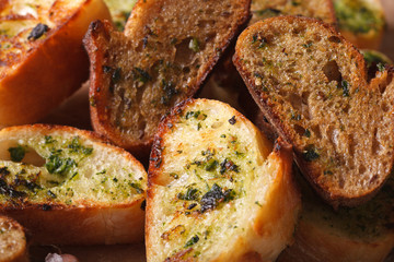 toasted bread with herbs and garlic macro. horizontal, rustic