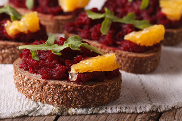 Sandwich with beetroot and orange close-up horizontal
