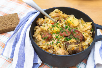 Traditional polish sauerkraut bigos with mushrooms