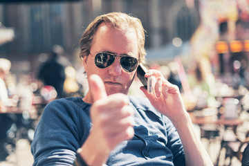 Handsome man giving a thumbs up gesture