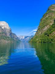 Fototapeta na wymiar Tourism and travel. Mountains and fjord in Norway.