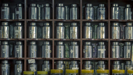 Rows of Metal Tea Canisters