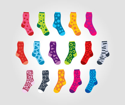 set of of socks with different patterns motives on a light backg