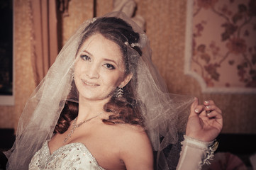 Portrait beautiful bride with bouquet of flowers on luxury