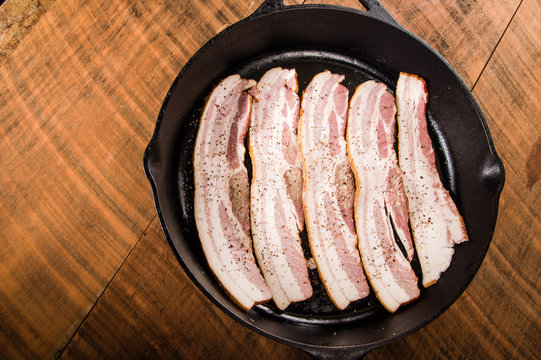 Cast Iron Skillet Of Bacon Overhead View