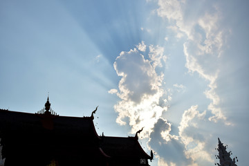 Fototapeta premium clouds on Sky shine over the roof of the castle 
