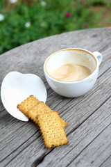 latte coffee in glass and crackers