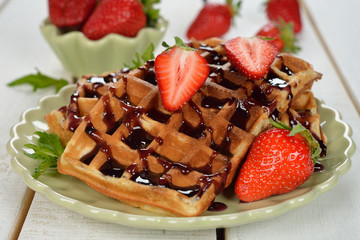 Waffles with topping and strawberries