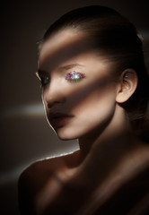Fototapeta premium Portrait of a woman in artistic light