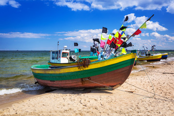 Fototapeta na wymiar Fishing boats on the beach of Baltic Sea in Poland