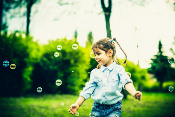 Happy little pretty girl outdoor in the park © bedya