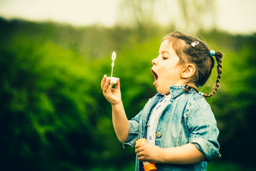 Happy little pretty girl outdoor in the park © bedya