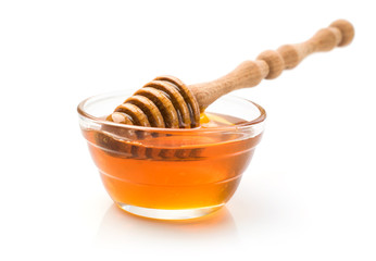 Honey with wooden dipper