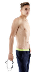 Portrait of a young man with swimming goggles on white backgroun